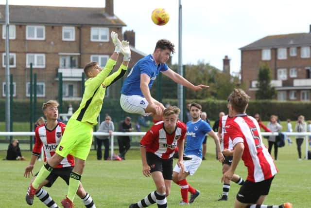 Bradley Lethbridge challenges for the ball as Pompey Academy take on Exeter City