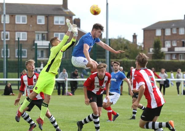 Bradley Lethbridge challenges for the ball as Pompey Academy take on Exeter City