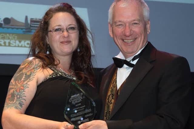 Emma Terracciano of Antler receives her award for Manager of the Year from Stef Nienaltowski. Picture: Keith Woodland