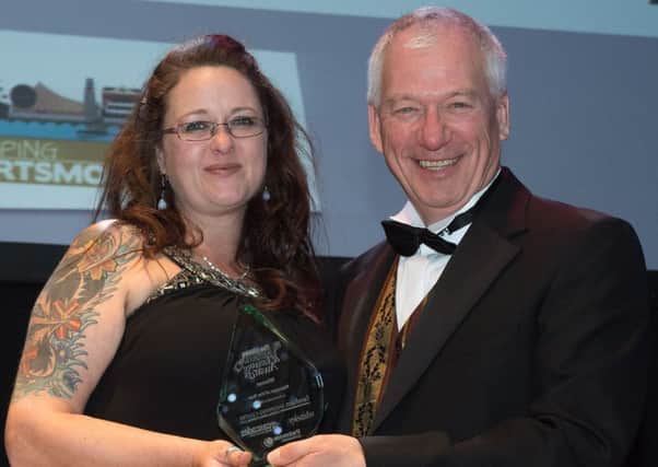 Emma Terracciano of Antler receives her award for Manager of the Year from Stef Nienaltowski. Picture: Keith Woodland