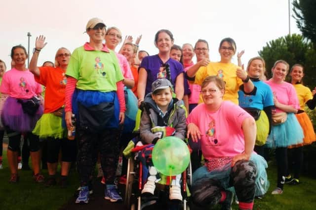 The women who took part in a 31-mile walk for Kicking Cancer For Charlie, a charity started by seven-year-old Charlie Harris, (front) from Hilsea, who has leukaemia