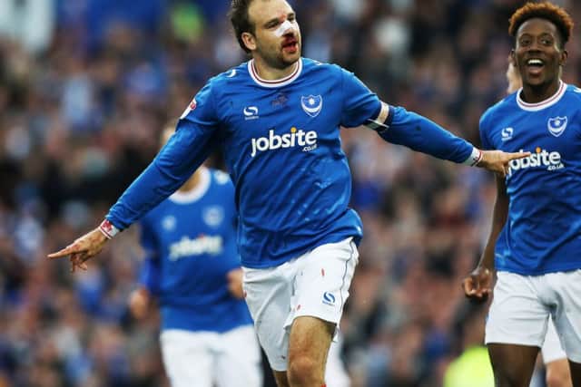 Brett Pitman picked up a broken nose when scoring Pompey's opener against Fleetwood on Saturday Picture: Joe Pepler