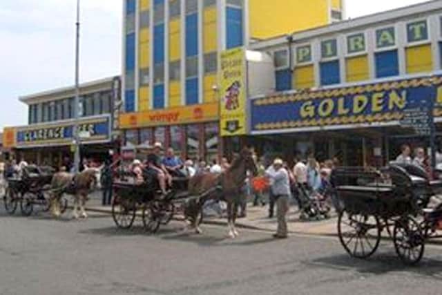Funnells horse-drawn wagonettes outside Clarence Pier, Southsea, in the early 2000s.
