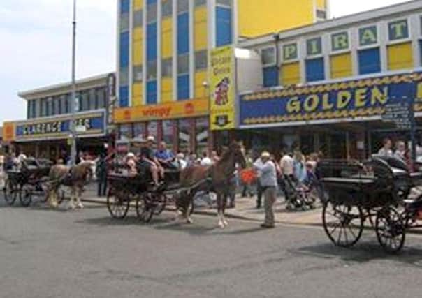 Funnells horse-drawn wagonettes outside Clarence Pier, Southsea, in the early 2000s.