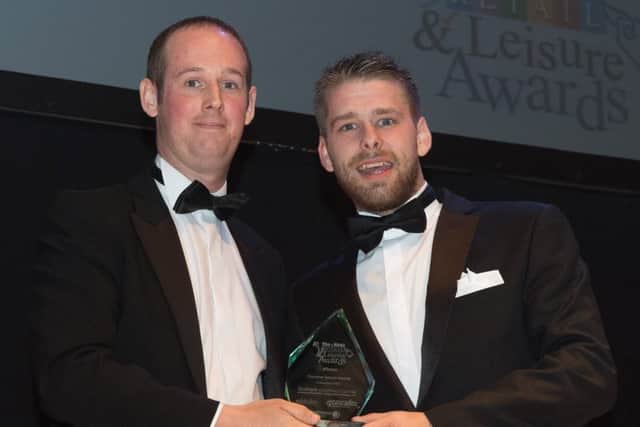 Fareham Shopping Centre manager Mike Taylor presents the Customer Service Award to Johnny White of Timpson   Picture: Keith Woodland