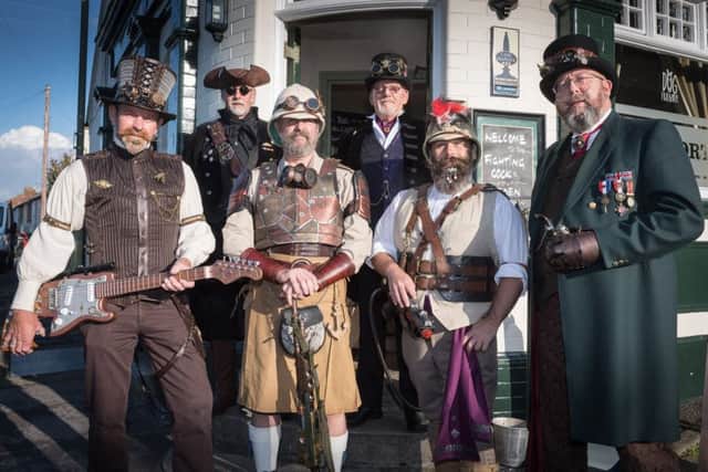 Members of the Gosport Steampunk Society gather outside the fighting Cock Pub. Picture Credit: Keith Woodland PPP-170917-194054006
