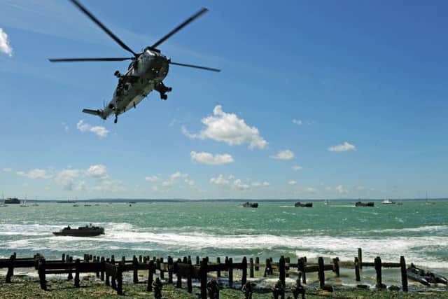 The Royal Navy and Royal Marines amphibious landing display at the 70th anniversary D-Day commemorations in 2014 on Southsea Common Picture: Allan Hutchings (141718-980)