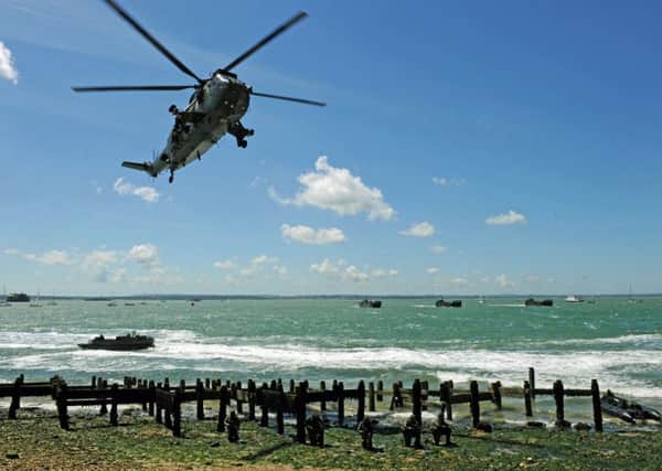 The Royal Navy and Royal Marines amphibious landing display at the 70th anniversary D-Day commemorations in 2014 on Southsea Common
Picture: Allan Hutchings (141718-980)