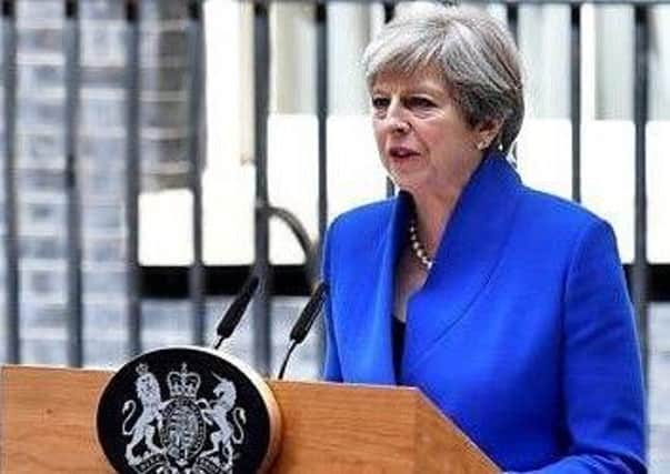 Theresa May talking outside Downing Street