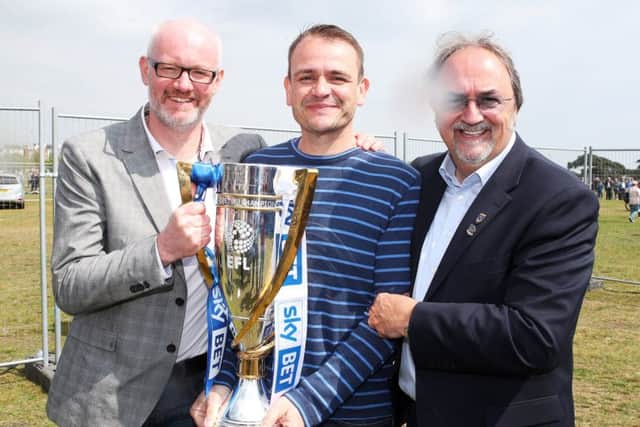 Brown, left, celebrates Pompeys League Two title win with John Kimbell and Mark Trapani on Southsea Common