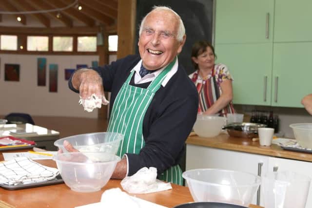 Basil Messenger has fun at a bread-making workshop. Picture: Habibur Rahmnan