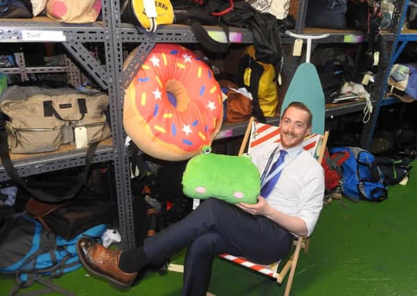 Michael Pugh with some of the lost property items left on South Western Railway trains