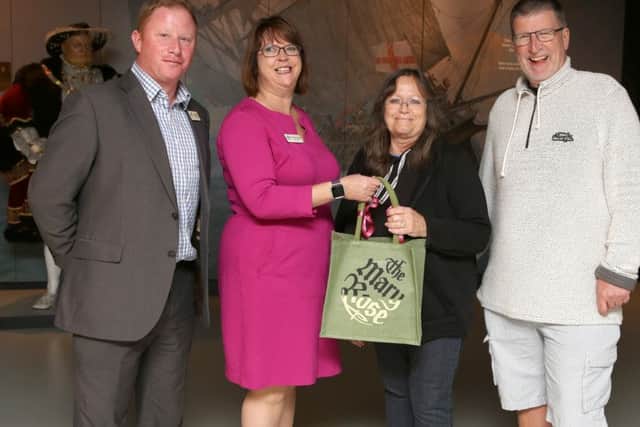Ten millionth visitors to the Mary Rose Sandra and Mike Perkins, right, receive a Mary Rose goody bag from head of Operations Paul Griffiths, left and chief executive, Helen Bonsor-Winton Picture: Habibur Rahman
