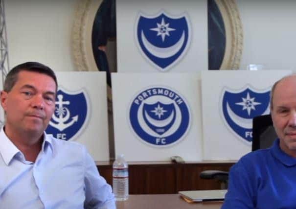 Mark Catlin, left, and Michael Eisner with the Pompey crest revamp designs. Picture: Portsmouth FC