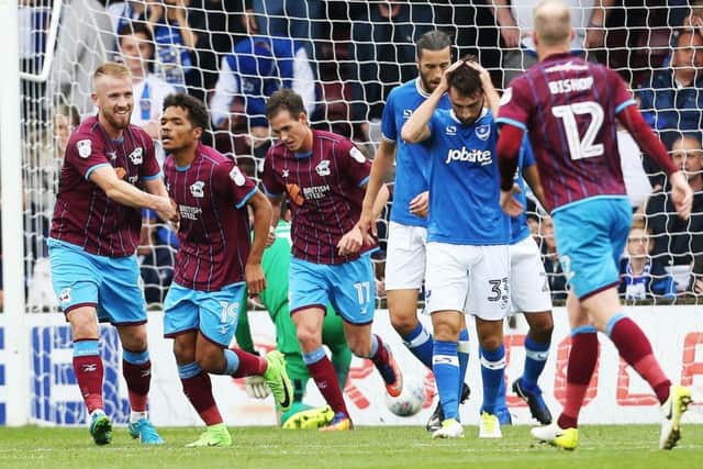 Scunthorpe celebrate Duane Holmes' strike in their 2-0 win against Pompey Picture: Joe Pepler