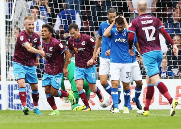Scunthorpe celebrate Duane Holmes' strike in their 2-0 win against Pompey Picture: Joe Pepler