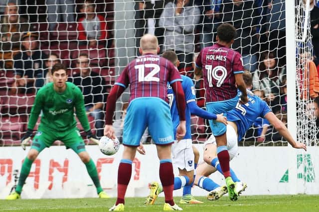 Duane Holmes hands Scunthorpe a 2-0 lead against Pompey at Glanford Park following a mistake by Blues defender Dion Donohue Picture: Joe Pepler