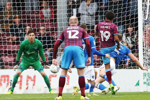 Duane Holmes scores Scunthorpe's second goal on Saturday following a mistake from Dion Donohue Picture: Joe Pepler