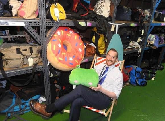 Michael Pugh, Lost Property Manager for South Western Railway, taking a break from filing items