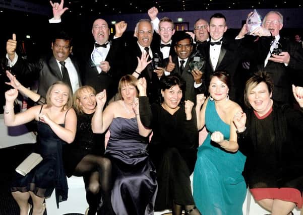 The team at Gemma Lighting celebrate after winning Overall Business of the Year in 2013