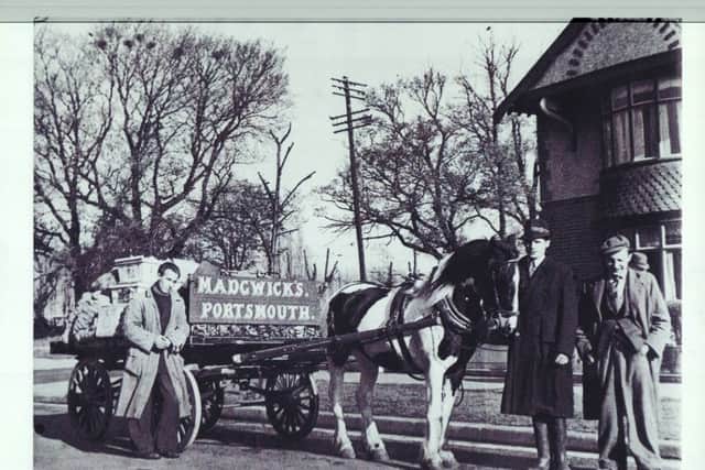 Roy Madgwick, holding Joey, with his two brothers-in-law John and Harry Marsh. They were delivering fruit and veg on the fledgling Highbury estate, Cosham.