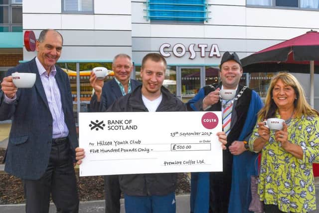 Costa presented a cheque to Hilsea LDD Youth Club for Â£500 at the official opening of the coffee shop