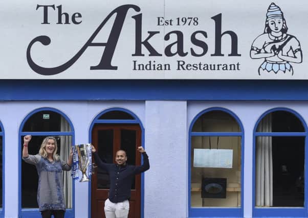 Clare Martin, director of Portsmouth in the Community, and Faz Ahmed, from The Akash. Picture: Roger Forman.