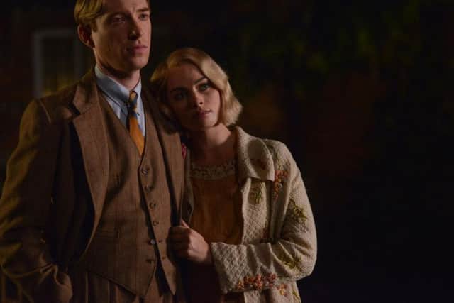 Domhnall Gleeson, as Alan Milne, and Margot Robbie, as Daphne Milne