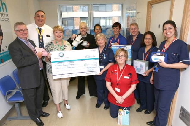City of Portsmouth Charitable Friends handing over money raised to the QA's Surgical Emergency Department