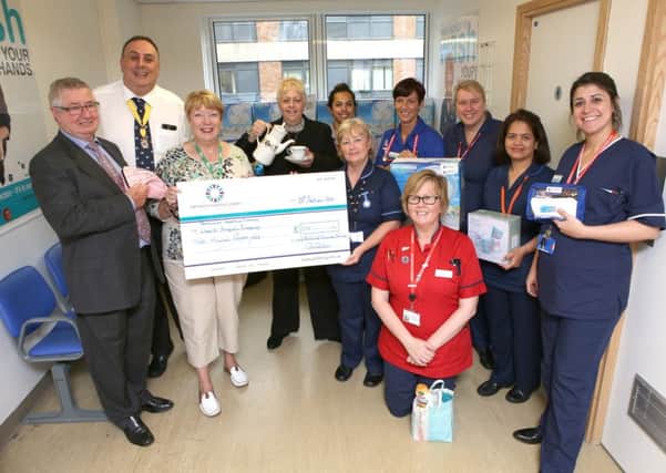 City of Portsmouth Charitable Friends handing over money raised to the QA's Surgical Emergency Department