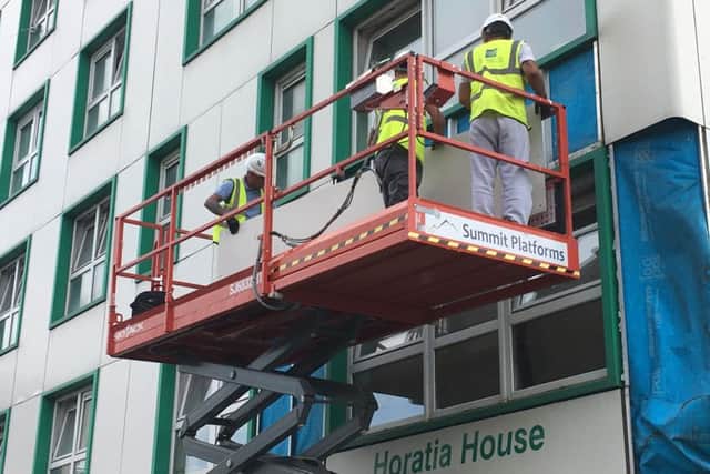 Cladding being removed at Horatia House in June.