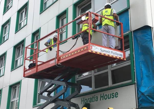 Cladding being removed at Horatia House in June.