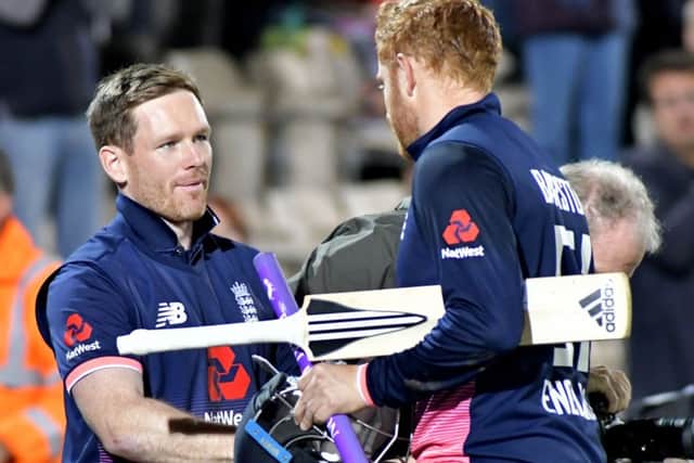 Jonny Bairstow, right, thanks skipper Eoin Morgan. Picture: Neil Marshall