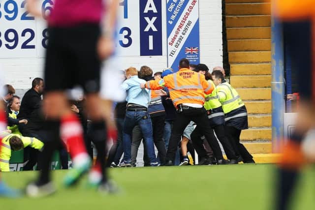 Fratton Park stewards were called on to prevent fans from clashing during today's game Picture: Joe Pepler