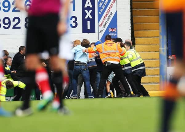 Fratton Park stewards were called on to prevent fans from clashing during today's game Picture: Joe Pepler