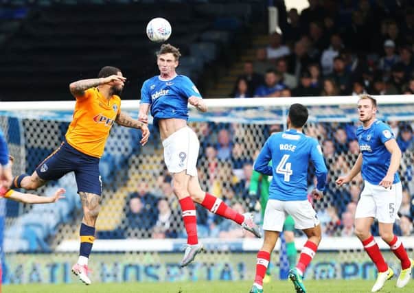 Pompey's Oliver Hawkins heads the ball in their League One match against Oldham. Picture Joe Pepler/Digital South