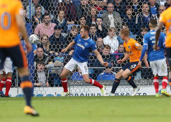 Eoin Doyle scores the opener for Oldham against Pompey Picture: Joe Pepler