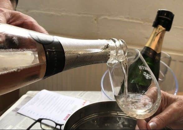 Sparkling wine being poured at Emsworth Wine Fair, 2017