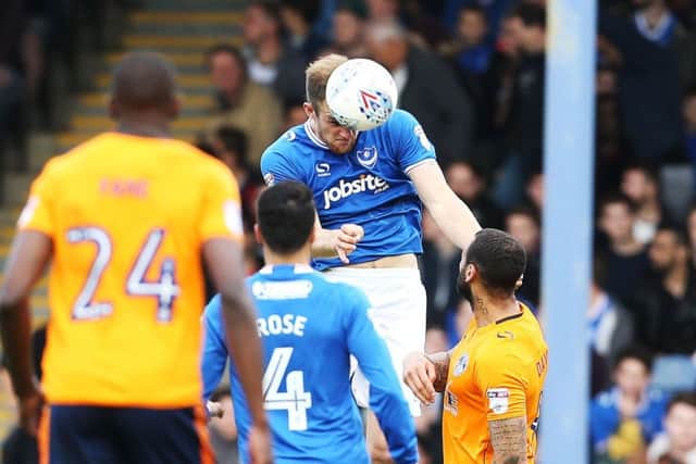 Matt Clarke wins a header against Oldham. Picture: Joe Pepler