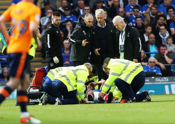 Nathan Thompson receives treatment after clashing heads with Drew Talbot against Oldham. Picture: Joe Pepler