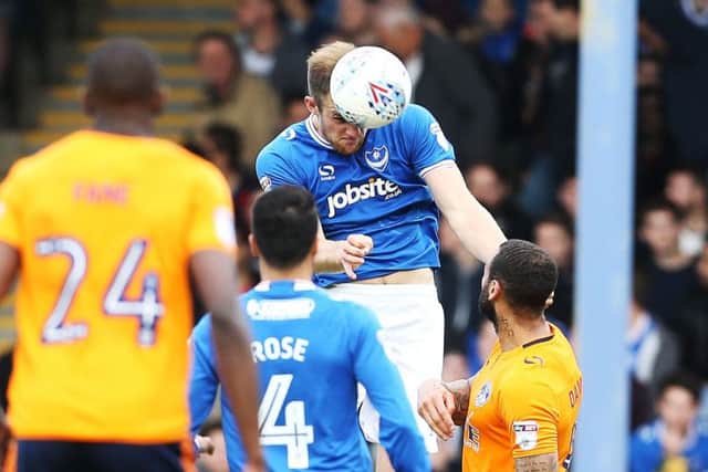 Matt Clarke wins a header against Oldham. Picture: Joe Pepler
