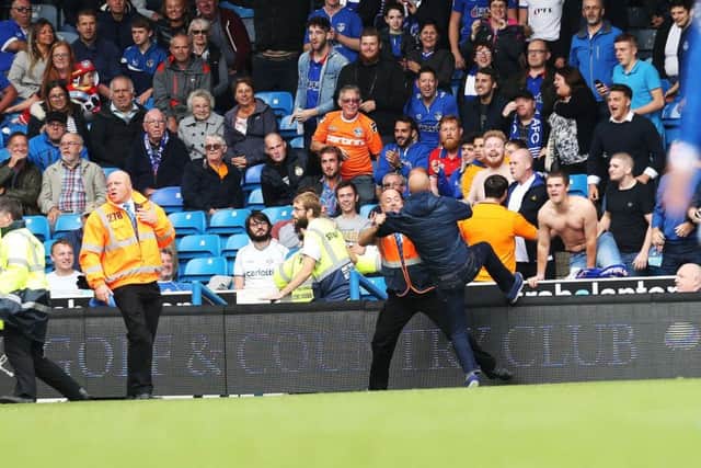There was a crowd disturbance in Pompey's defeat to Oldham on Saturday. Picture: Joe Pepler
