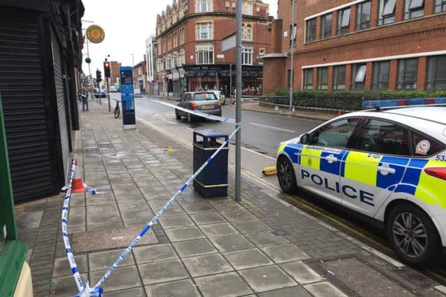 Police outside an alleyway next to Scoops, in Elm Grove, Southsea, Portsmouth.