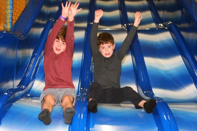 Elliott Pearce 8, and brother Dylon, 6 enjoy the fun at Havant Leisure Centre      Picture: Derek Martin