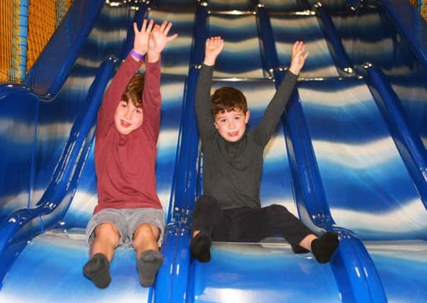 Elliott Pearce 8, and brother Dylon, 6 enjoy the fun at Havant Leisure Centre      Picture: Derek Martin