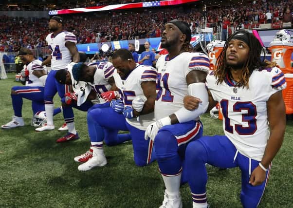 Buffalo Bills players 'take a knee' during the national anthem before the first half of an NFL game against the Atlanta Falcons on Sunday.                                Picture: AP Photo/John Bazemore
