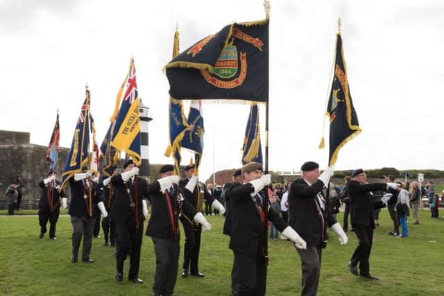 Veteran standard-bearers march in front of Southsea Castle. Picture: Duncan Shepherd