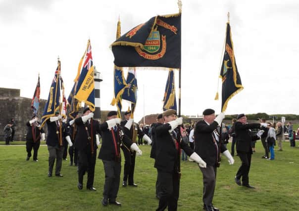 Veteran standard-bearers march in front of Southsea Castle. Picture: Duncan Shepherd