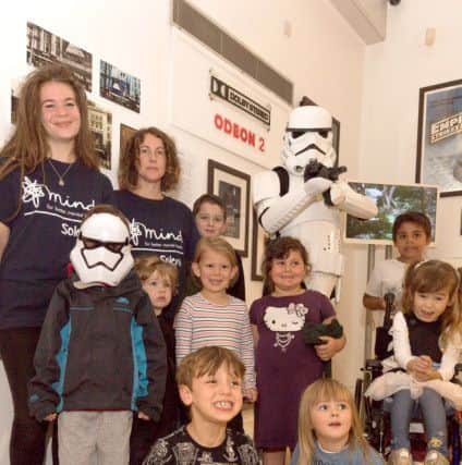 The Solent Mind Stormtrooper with some of his fans and Solent Mind volunteers. Picture: Keith Woodland PPP-170930-203409006