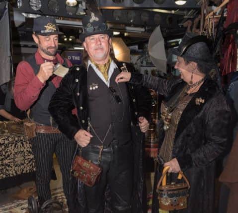 The KGB Innovations proprietor brushes Broc Taylor while his wife Sheila adjusts his waistcoat. Picture Credit: Keith Woodland PPP-170930-202951006